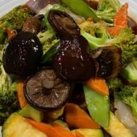 Black Mushrooms Stir-Fried With Mixed Vegetables. · Stir-fried in a brown garlic sauce.
