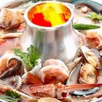 Tom Yum (Large (32 Oz) ) · Hot and sour soup with mushrooms, tomatoes, lemon grass, galangal roots, and chili paste. Ch...