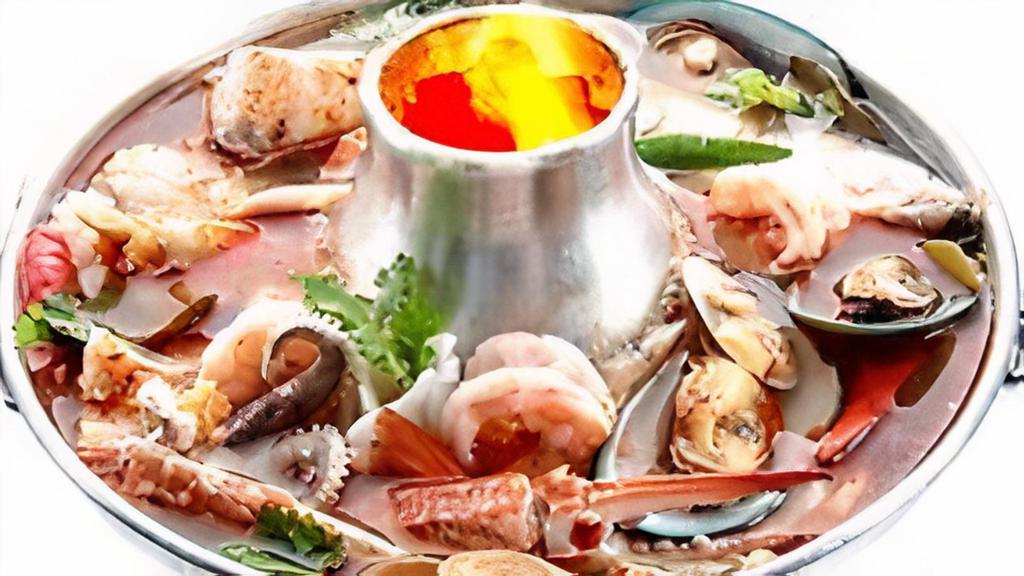 Tom Yum (Large (32 Oz) ) · Hot and sour soup with mushrooms, tomatoes, lemon grass, galangal roots, and chili paste. Choice of Protein: Vegetable, Tofu, Chicken, Pork, Beef, Shrimp, Squid, or Seafood (shrimp and squid). Beef, Shrimp, Squid, or Seafood (shrimp and squid) for additional charges.