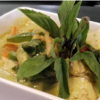 Gang Keow Wan · Thai green curry paste in coconut milk, eggplants, bell peppers and basil, and bamboo shoots.