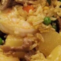 Pineapple Fried Rice · Fried rice with egg, chunks of pineapples, cashew nuts, and mixed vegetables.
