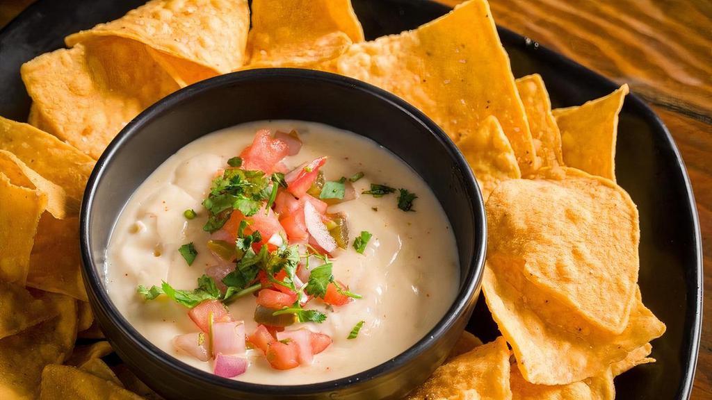 Queso & Chips (Vegetarian) · Tortilla chips, queso, salsa, cilantro