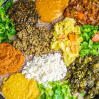 Vegan Signature Plate · A sampling of all our Vegan dishes served with salad and Injera.