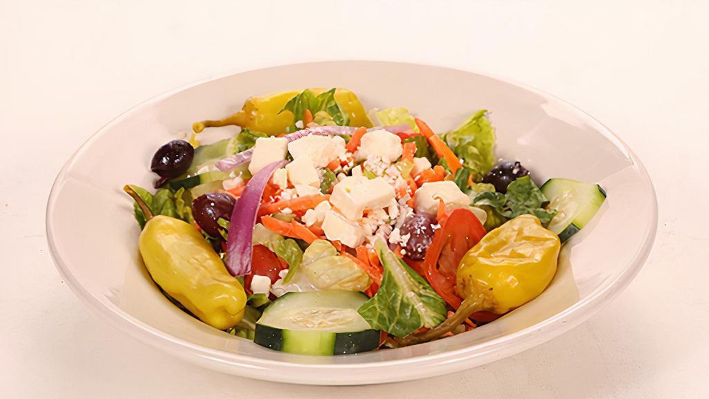 Greek Salad · Lettuce, tomatoes, carrots, cucumbers, feta cheese, kalamata olives, pepperoncini, onions and house vinaigrette.