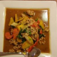 Thai Pumpkin Curry · Spicy. Red curry paste in coconut milk, pumpkin, bell peppers, basil leaves and your choice ...