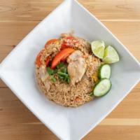 House Fried Rice · Fried rice with our house sauce, egg, onions, tomatoes, carrots, and snow peas; garnished wi...
