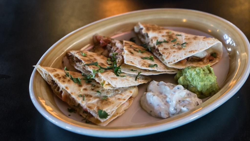Matador Quesadilla · Monterey jack, guacamole, pico de gallo and cilantro-limé sour cream cheese. (Cheese - No Pico)
