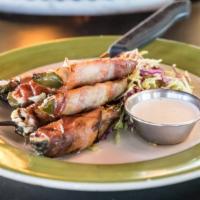 Goat Cheese Jalapeños · Goat cheese, hickory smoked bacon and ranch dressing. Gluten-free.