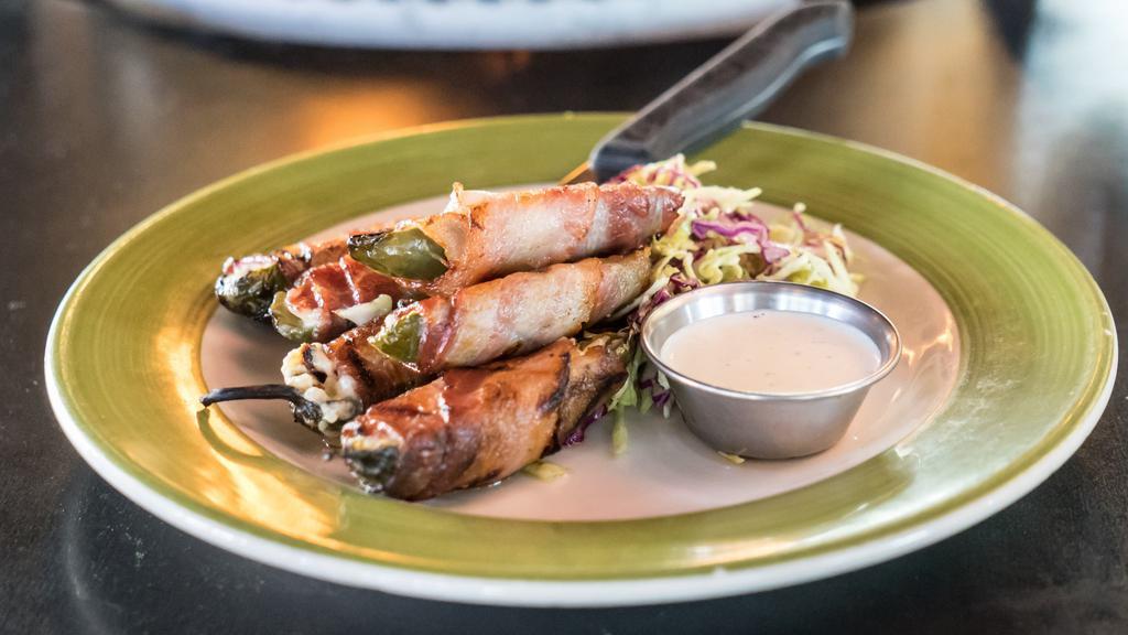Goat Cheese Jalapeños · Goat cheese, hickory smoked bacon and ranch dressing. Gluten-free.
