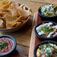 Dip Flight · All of our favorite dips! Creamy three cheese queso, fresh guacamole, and hearty black bean ...