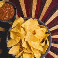 Chips & Salsa · House tortillas chips and roasted tomato salsa.  Gluten-free, vegetarian.