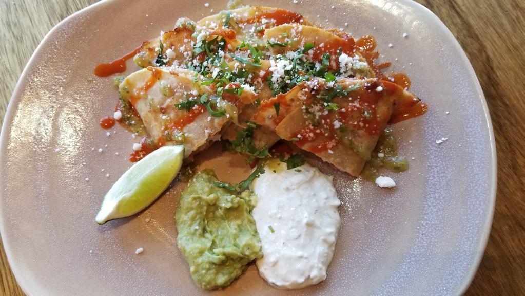 Quesadilla Sayulita · Griddled Monterey Jack cheese, chipotle shrimp, hot sauce, pico de gallo, guacamole, cilantro-lime sour cream, corn tortillas