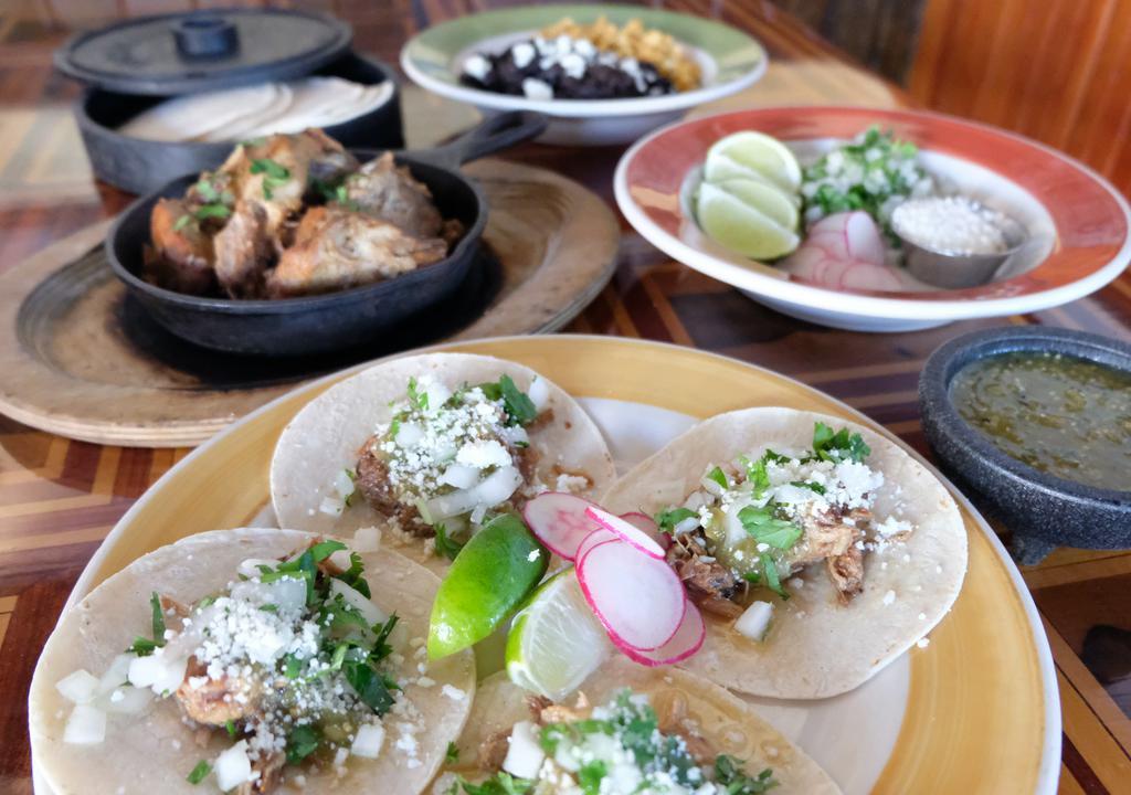 Street Tacos For Four (Pick Two): · Four small corn tortillas per person, tomatillo salsa, cotija, onion, cilantro, lime.                                                              
Consuming raw or undercooked food items may increase your chance of food-borne illness.