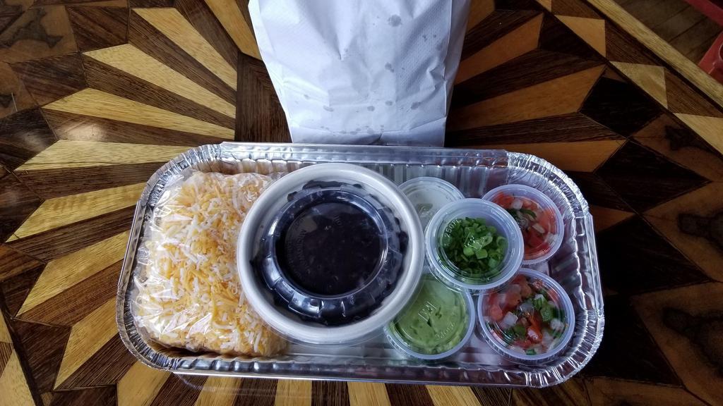 Take & Bake Nachos · Our famous nachos, deconstructed into a meal kit and all ready for you to prepare at home! Corn Tortilla chips, Mexican black beans, cheese blend, guacamole, sour cream, pico de gallo