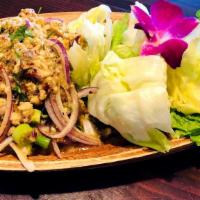 Larb Gai · Ground chicken, cilantro, onion, green onion, lettuce, and lime leaves.