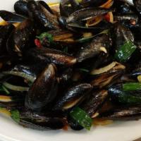 Basil Mussels · Stir-fried mussels with chilli paste, onions, green onions and basil.( come with rice)