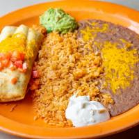 Chimichanga Fajita · Flour tortilla filled with chicken or steak or pork, onions and green peppers, deep fried, s...