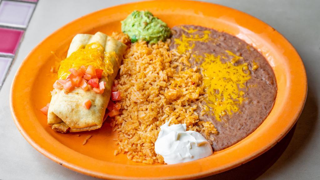 Chimichanga Fajita · Flour tortilla filled with chicken or steak or pork, onions and green peppers, deep fried, served with sour cream, guacamole and cheese.