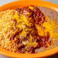 Enchilada Colorado · Two corn tortillas filled with chunks of beef and topped with tasty Colorado sauce and melte...