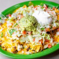 Nachos Fajita · Choice of meat, chicken or steak or shredded pork, served with beans, tomatoes, cilantro, on...