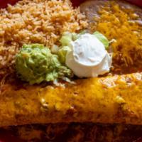 Burrito Carnitas · Choice of chicken, steak or pork. Wrapped in a flour tortilla served with green pepper, onio...
