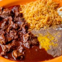 Birria · Chunks of beef cooked in a tasty Chile sauce (red mild chili sauce).