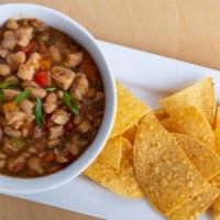 White Chicken Chili - Cup · Chicken breast, white chili beans, peppers, herbs and spices.