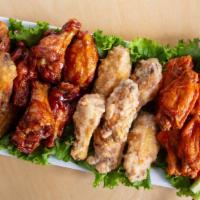Chicken Wing Dinner · 8 flavored wings of your choice 2 sides and a corn muffin