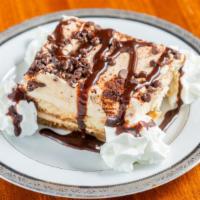 Tiramisu · Homemade traditional Italian dessert with layers of coffee and liqueur dipped lady fingers a...