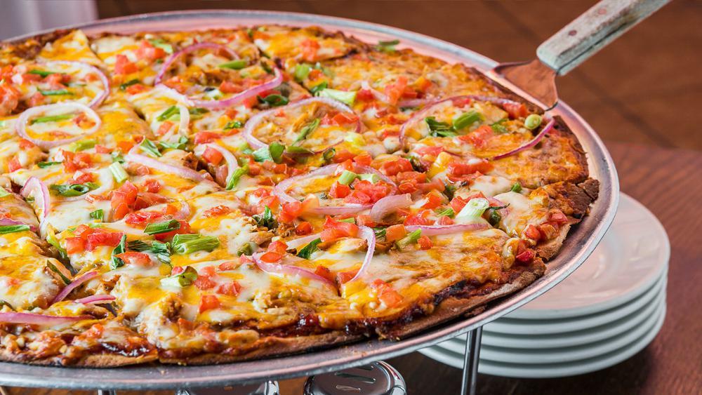 The Yahoo Barbecue Chicken Pizza · Who doesn't like a good barbecue? We pile on our tasty chicken (what else?), cotija, cheddar and Wisconsin cheeses, red onions, scallions, diced tomatoes, and oregano's own bbq sauce. This pizza will leave a mark on you. Get branded!