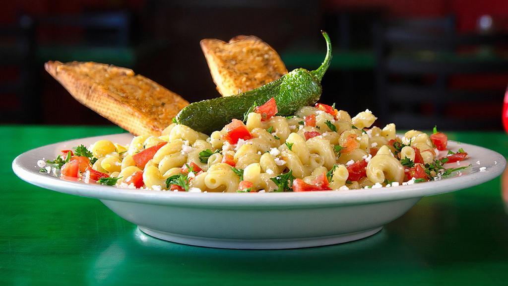 Alfredo The Dark · Poblano peppers and a blend of southwest cheeses are sauteed with spiral pasta and topped with diced tomatoes, a tasty jalapeno and served with garlic bread.