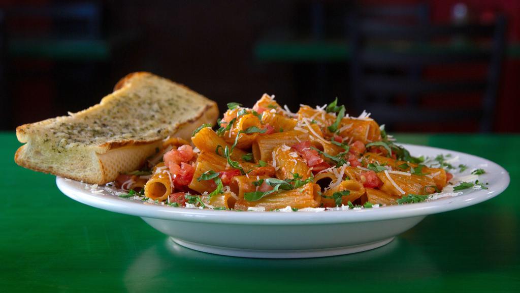 Big Rig Pasta · Rigatoni pasta covered with a tasty tomato chipotle cream sauce, chopped basil, diced tomatoes, Parmesan and a spicy finish.