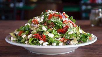 Oregano’S Favorite · And soon to be yours! Fresh Romaine blend, roasted red peppers, our spiced feta cheese, comb...