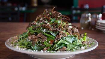 The Big Beefstro Salad · We start with a LARGE amount of our tasty shaved ribeye, add jalapenos, cotija cheese, tomat...