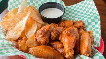 Jumbo Wings · Try these kick-fanny award winners in any of our six tasty flavors. Served with our homemade potato chips. 
*Due to manufacturer packaging shortages we may not be able to serve your wings with our great dipping sauce. You’re your wings may be served with an alternative ranch or blue cheese.