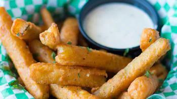 Italian Fried Zucchini · These skinny zucchinis are lightly battered and fried to a golden perfection. Served with a side of ranch dressing for your dipping pleasure.