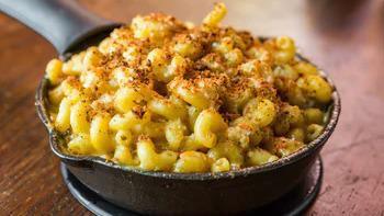 Mom'S Mac N' Cheese · Spiral pasta, Alfredo sauce, blended chipotle peppers and cheddar cheese topped with cotija cheese, bread crumbs, baked in a skillet and served with our garlic bread. Want it traditional style, just ask!