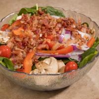 Spinach Salad · Fresh spinach, bacon, red onion, mushrooms, red pepper, and tomato create a most satisfying ...