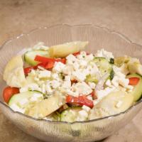 Greek Salad · Fresh tomatoes, red onion, feta cheese, artichoke, olives, cucumbers, and red bell pepper ar...