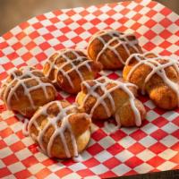 Cinnamon Knots · Hot and fresh from the oven. Topped with cinnamon and drizzled with frosting. The perfect id...