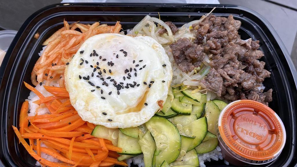 Bulgogi Bibimbap · Mixed vegetables(carrot, zucchini, bean sprout, radish) and bulgogi beef layered on white rice with special Korean spicy sauce, gochujang and sunny side up egg on top.