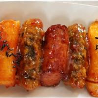 So Duk Kim · Combination of deep fried Korean rice cake, sausage, and seaweed spring roll with hot & swee...