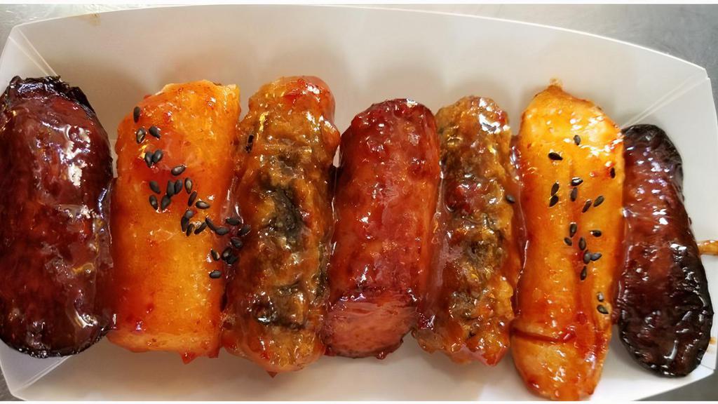So Duk Kim · Combination of deep fried Korean rice cake, sausage, and seaweed spring roll with hot & sweet special sauce.