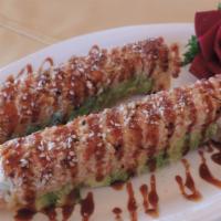 Golden Finger Roll · Shrimp tempura topped with spicy crabmeat, avocado and eel sauce.