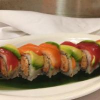 Manhattan Roll · Spicy crab meat on the inside topped with avocado, tuna and salmon. Raw.