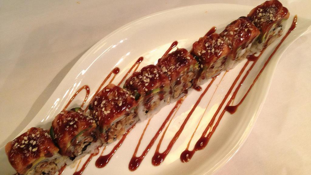 Ninja Roll · Fried soft shell crab topped with avocado, spicy tuna and glazed with house special sauce. Raw.