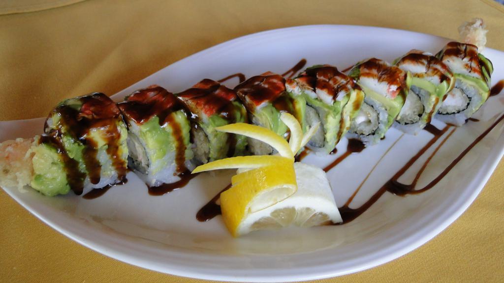 Friend Roll · Shrimp tempura inside covered with avocado, snow crab and eel sauce.