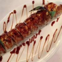 Yummy Roll · Shrimp tempura and spicy crabmeat wrapped with seared tuna topped with Japanese spicy mayo w...