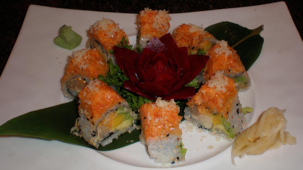 Phoenix Roll · Albacore tuna, super white tuna, avocado and mango topped with spicy salmon crunch with house special sauce. Raw.