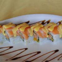 Golden Roll · Salmon, fresh mango, cucumber and cilantro topped with salmon and house mango sauce. Raw.